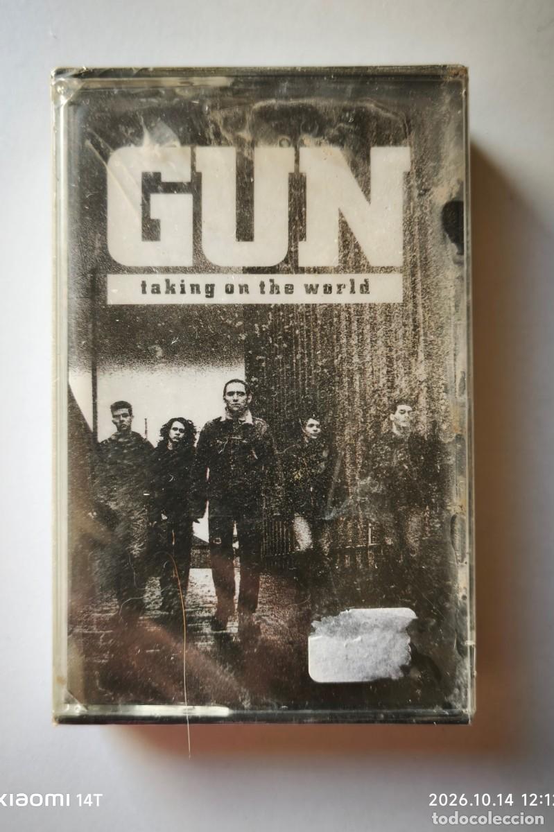 Cassetes antigas: GUN-TAKING ON THE WORLD ( AM RECORDS 397007-4). CASETE.