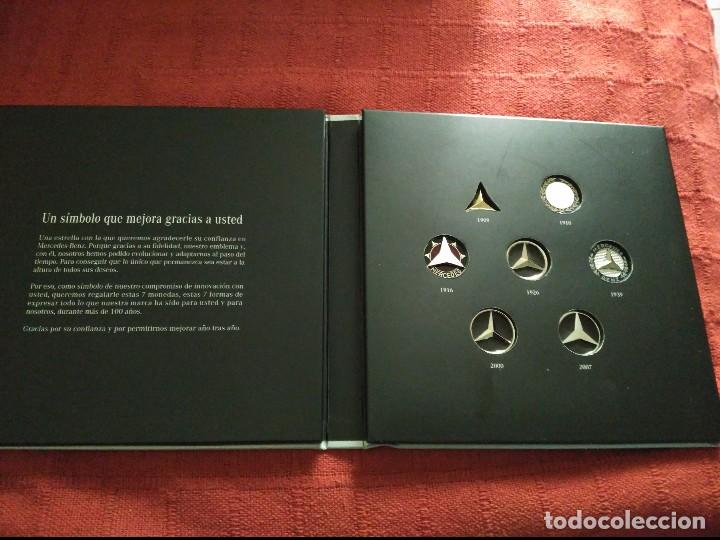 Carros e motociclos: caja conmemorativa de mercedes benz con 7 simbolos usados en su historia hechos en metal