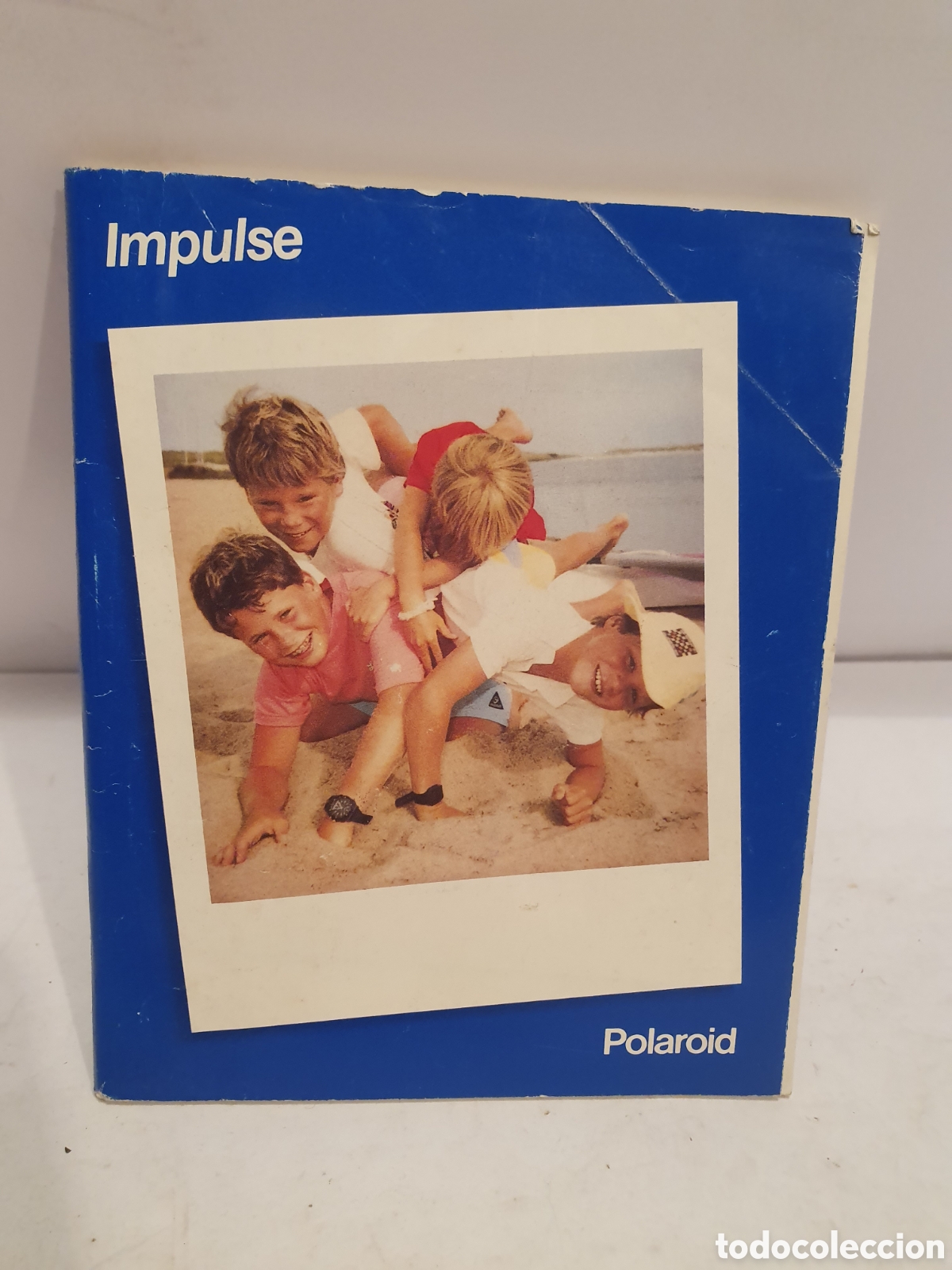 Werbekataloge: POLAROID. IMPULSE. MANUAL DE INSTRUCCIONES. VARIOS IDIOMAS. 1988.
