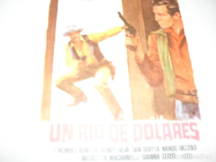 Cine: programa de mano sencillo,sin texto publicitario .titulo:UN RIO DE DOLARES.