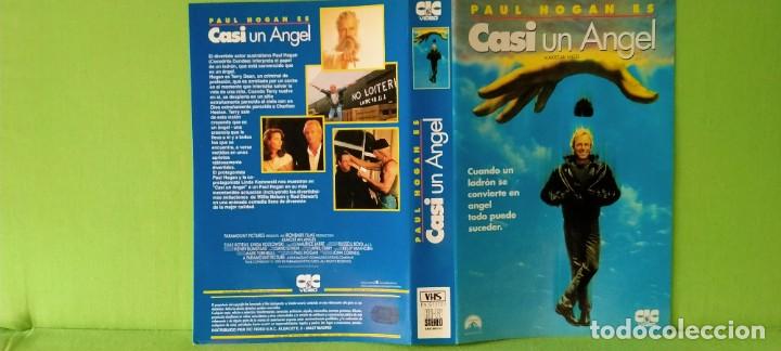Cine: S&oacute;lo car&aacute;tula - VHS - Casi un &Aacute;ngel 1990 Paul Hogan L. Kozlowski Charlton Heston *Pedido m&iacute;nimo 5&euro;