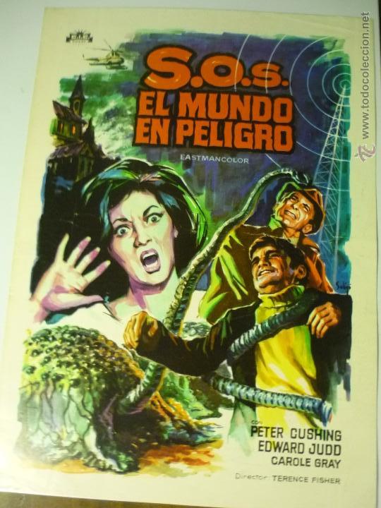 Cine: guia doble s.o.s. el mundo en peligro .- peter cushing.-dibujo soligo