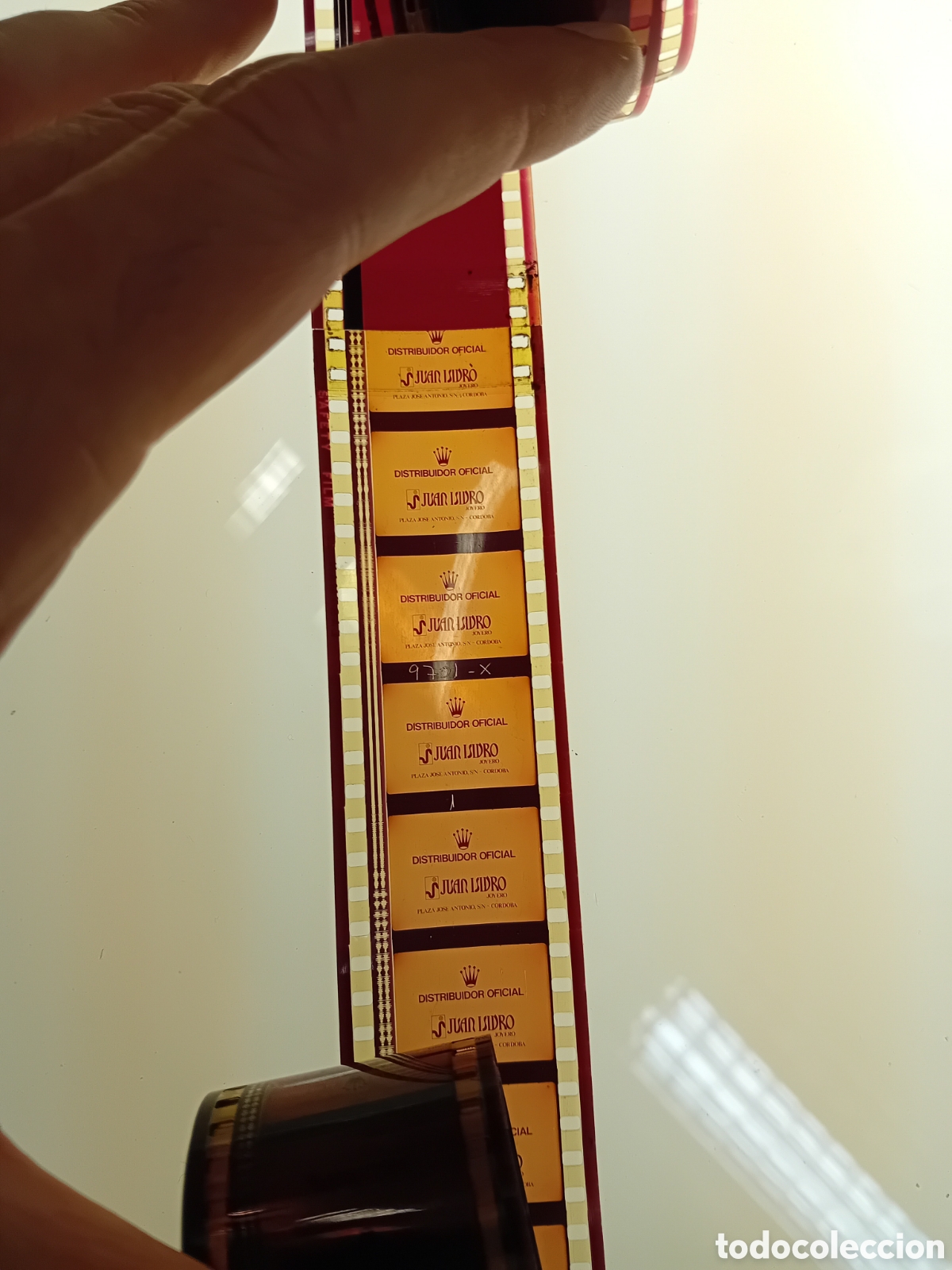 Cine: ROLLO 35MM CON COLA DE JOYERIA JUAN ISIDRO (CORDOBA) ANUNCIO DE ROLEX. A&Ntilde;OS 70