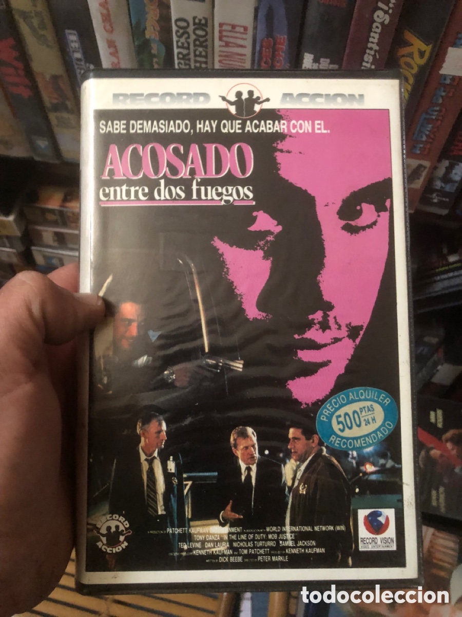 Cine: VHS V&Iacute;DEO CLUB ACOSADO ENTRE DOS FUEGOS