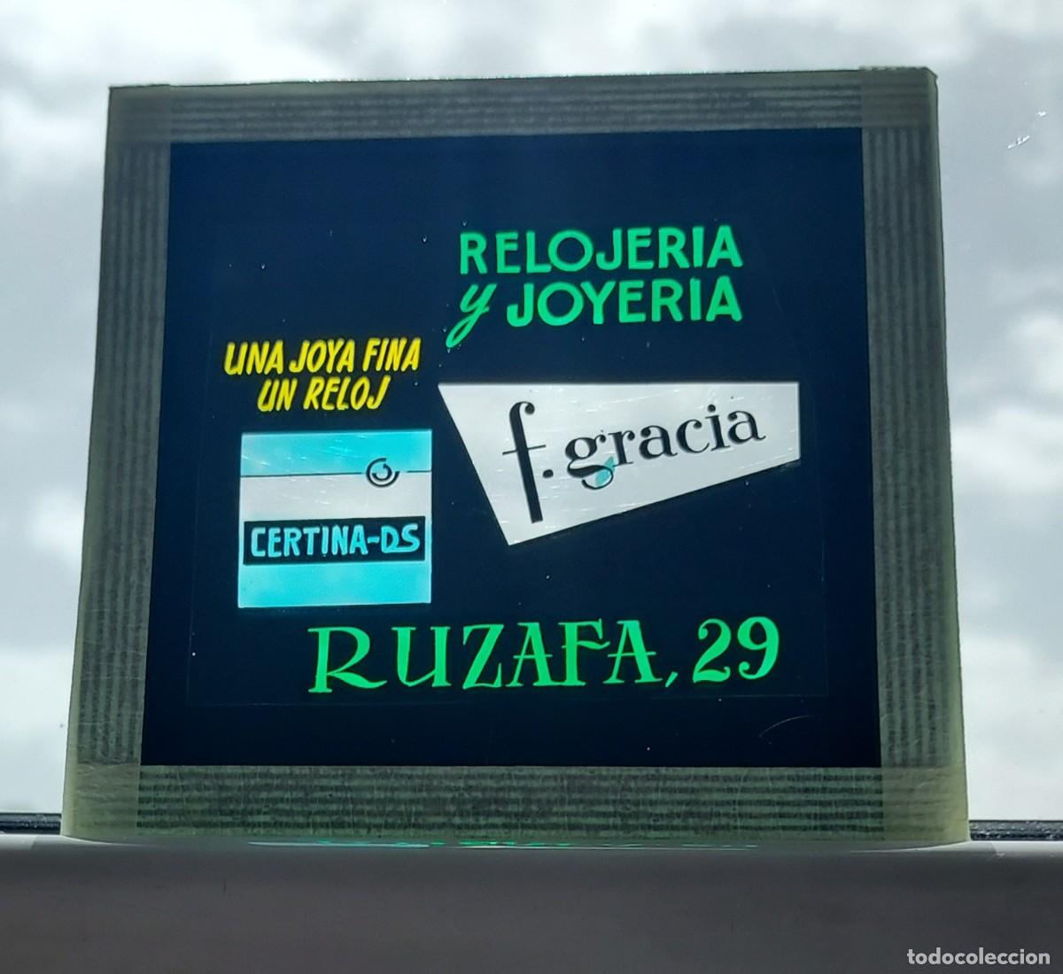 Cinema: DIAPOSITIVA PROYECCI&Oacute;N ANUNCIO CRISTAL CINE. RELOJER&Iacute;A Y JOYER&Iacute;A F. GRACIA. 8cm. x 8cm.