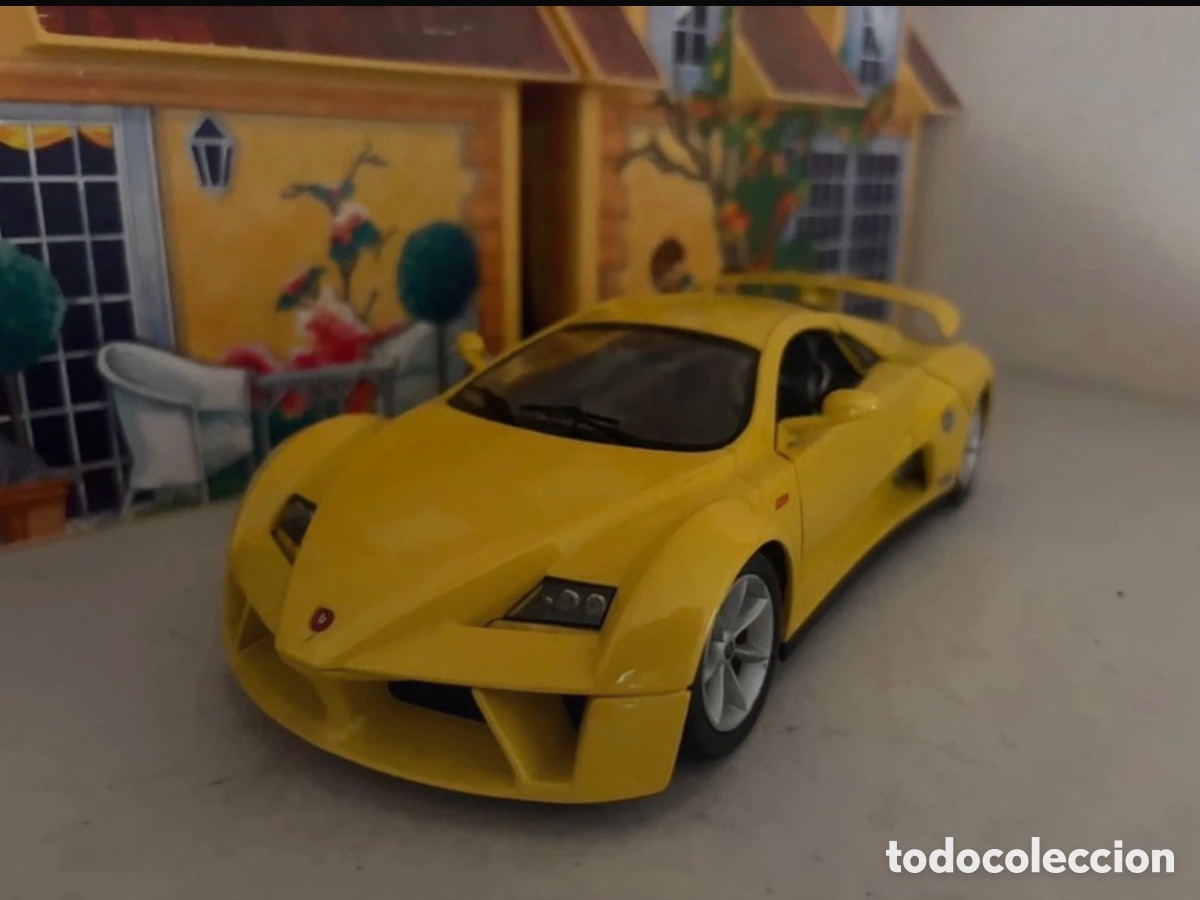 Modellautos: Bburago prima coche amarillo