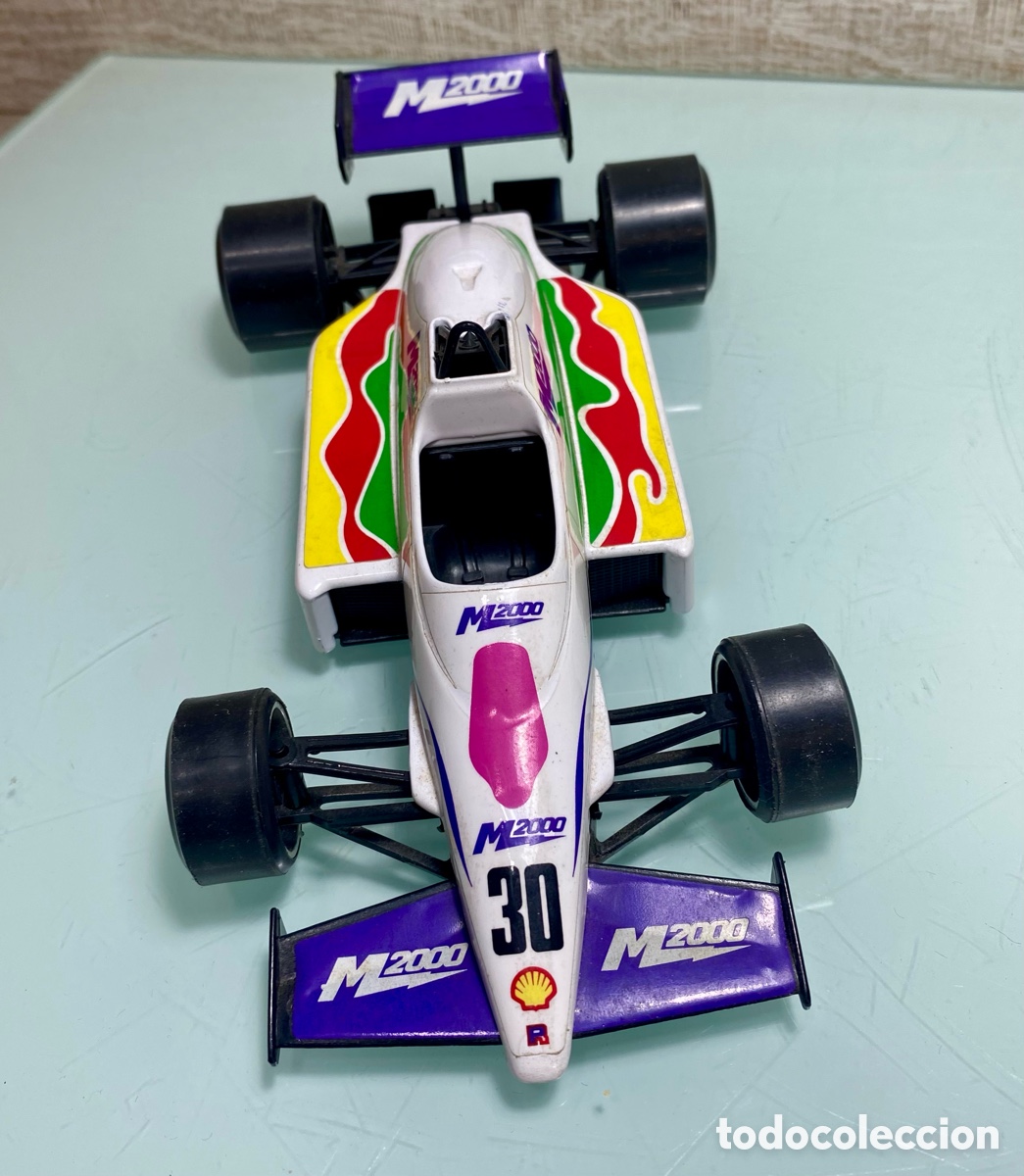 Coches a escala: Coche Burago F1 M200 Banespa. Escala 1/24