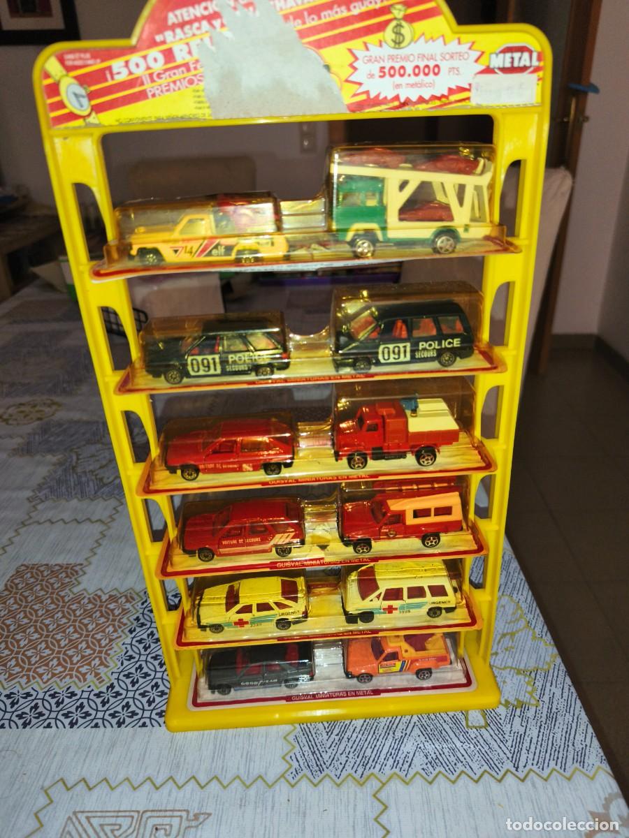 Coches a escala: Expositor Guisval sin abrir. 12 miniaturas.