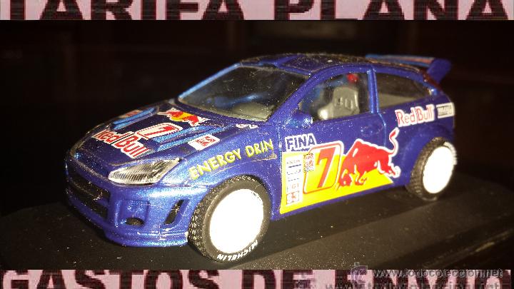 Voitures &agrave; l'&eacute;chelle: FORD FOCUS WRC ESCALA 1:43 DE BURAGO MODIFICADAS LAS RUEDAS (NO SE MUEVEN SON FIJAS) EN CAJA NO O