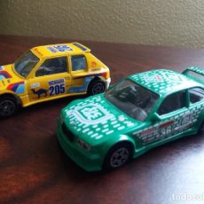 Coches a escala: DOS COCHES PEUGEOT 205 Y BMW M3. 1/43. MARCA BURAGO. MADE IN ITALY.