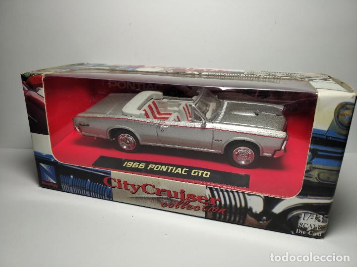 Model Cars: PONTIAC GTO 1966 DE NEW RAY 1,43 NUEVO EN SU CAJA