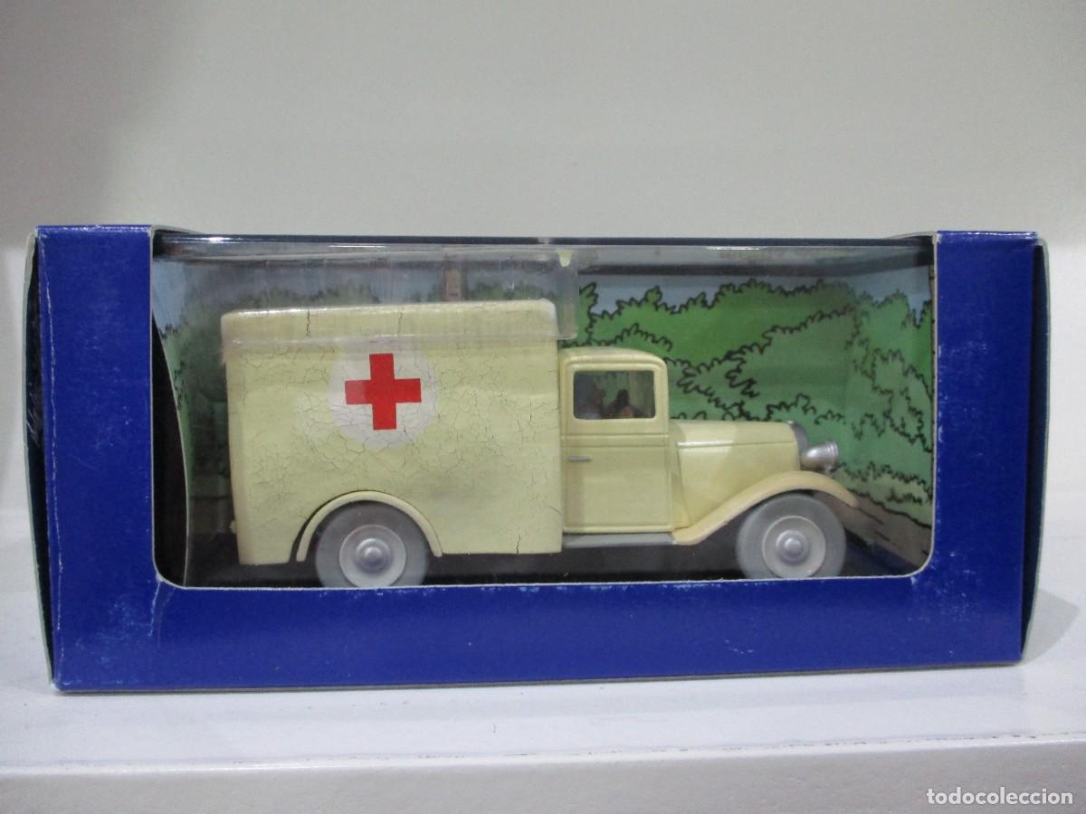 Coches a escala: COCHE TINTIN - AMBULANCIA CON FOLLETO - LOS CIGARROS DEL FARAON -ATLAS - ESCALA 1/43 - NUEVO