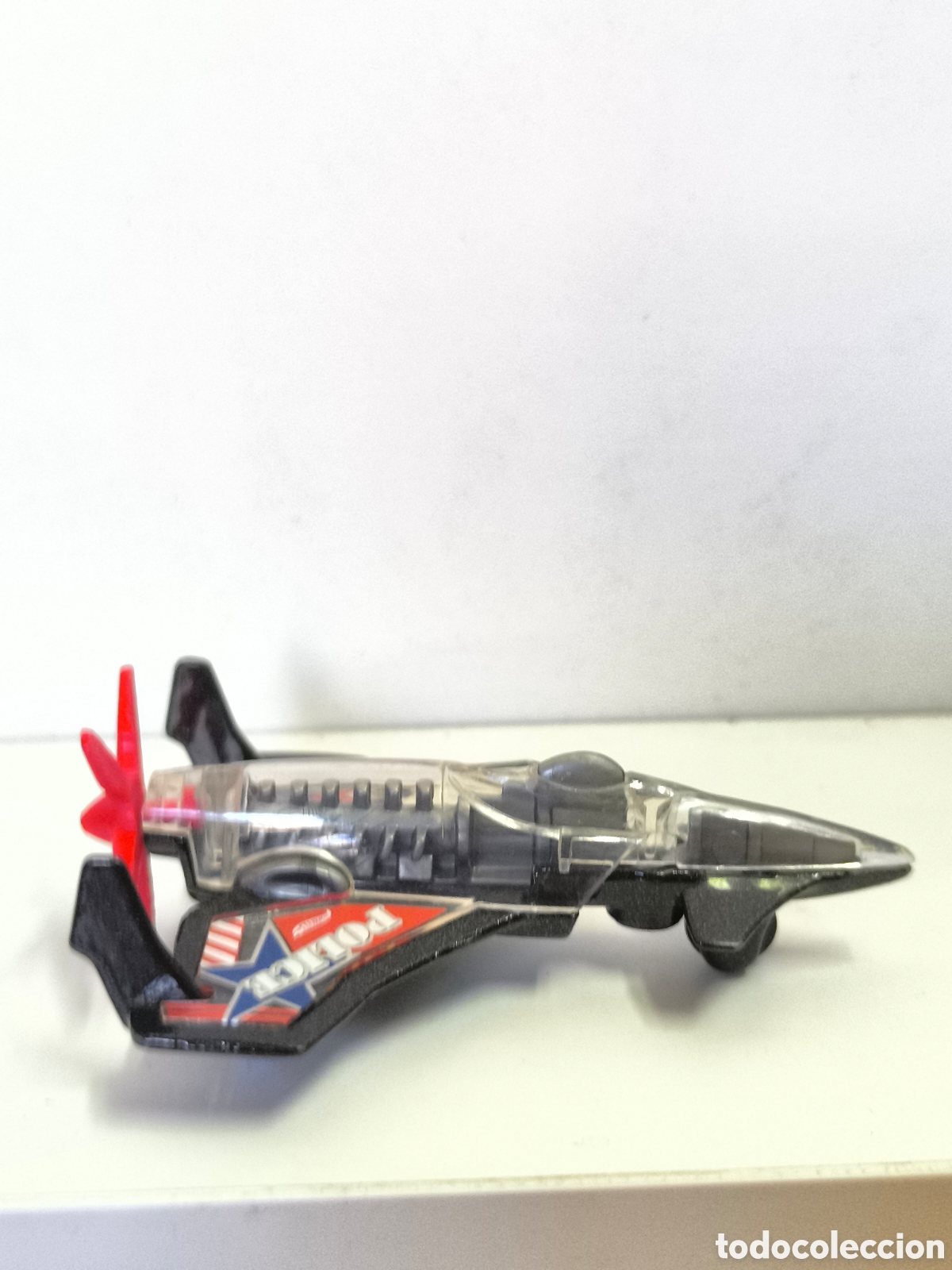 Coches a escala Hot Wheels: HOT WHEELS POISON ARROW BLACK & CLEAR 3 1/8&rdquo; DIECAST POLICE AIRPLANE CAR W/ RED