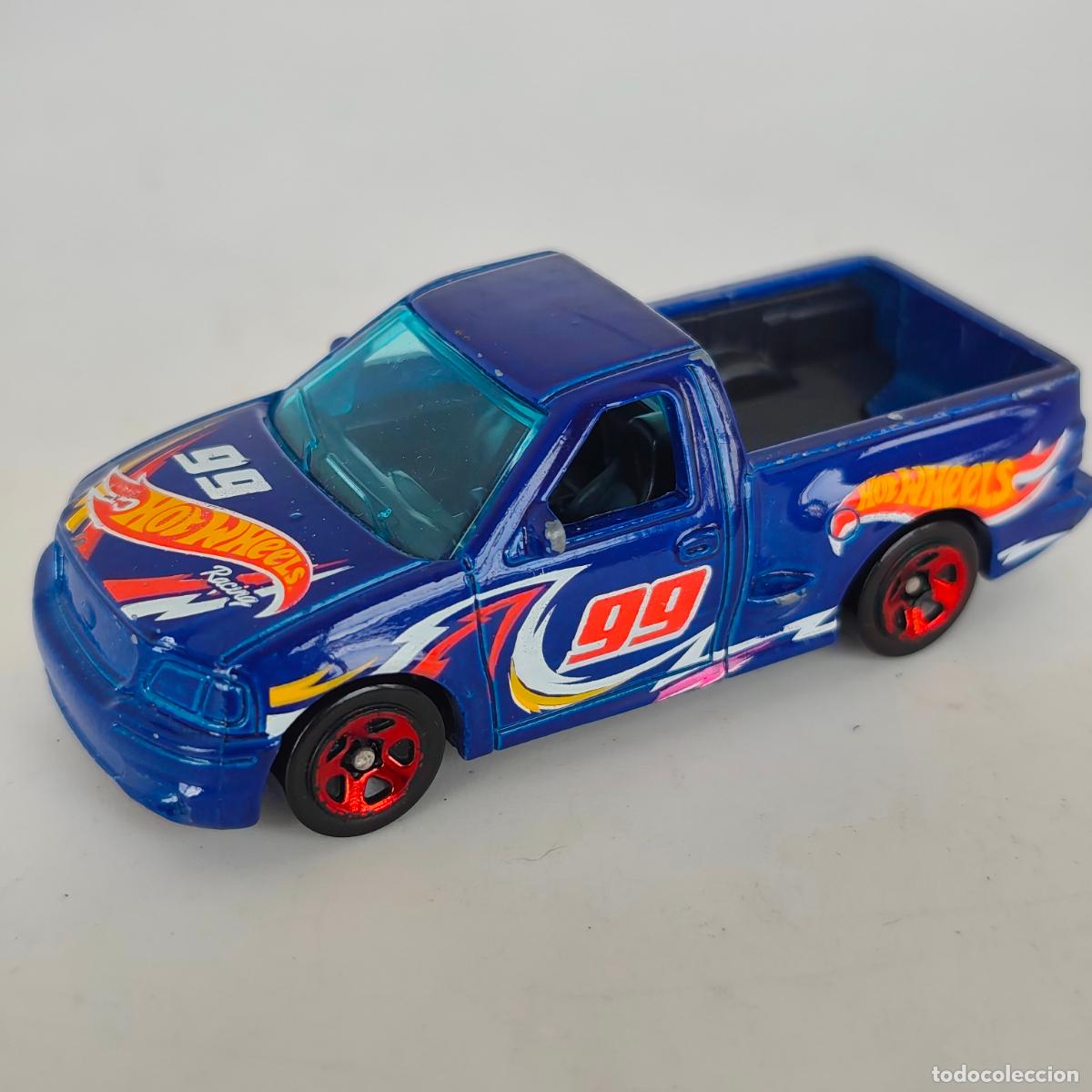 Coches a escala Hot Wheels: Ford F-150 SVT Lightning '99 Hot Wheels 2022 HW Race Team Mattel