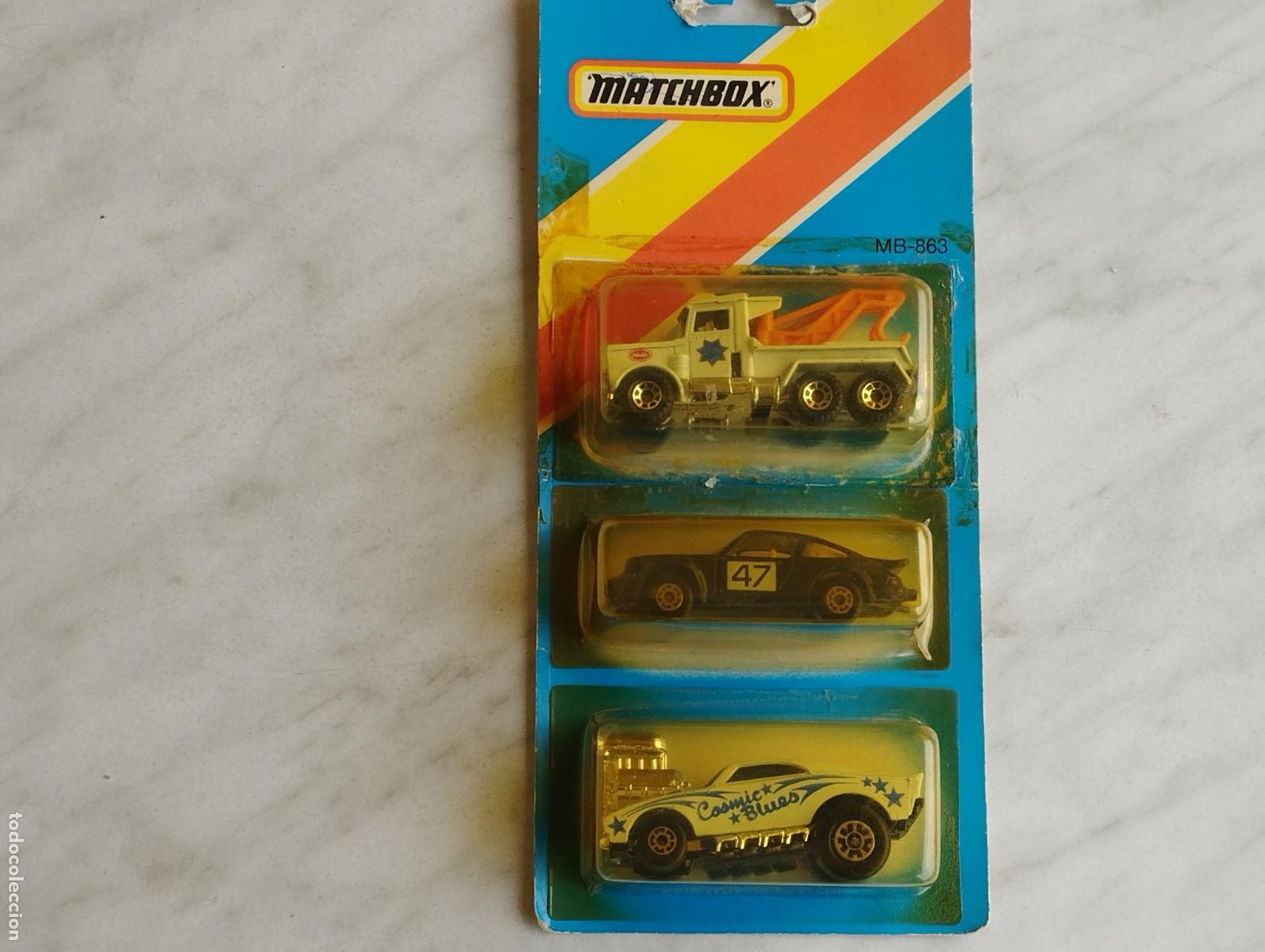 Coches a escala Matchbox: SET CONJUNTO EXPOSITOR MATCHBOX COSMIC BLUE PORSCHE 911 PETERBILT NUEVO EN SU CAJA BLISTER