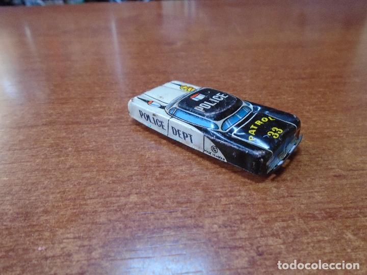 Coches a escala: ANTIGUO COCHE DE POLIC&Iacute;A DE HOJALATA