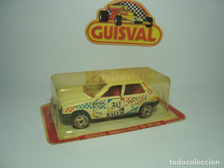 Coches a escala: PEUGEOT 205 DE GUISVAL CAMPEON 1,64 ULTIMA SERIE.FIN DEL MODELO. NUEVO EN CAJA.
