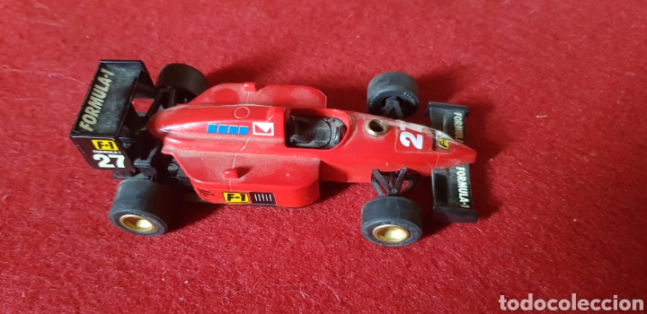 Model Cars: Coche formula 1 creo que es un mechero