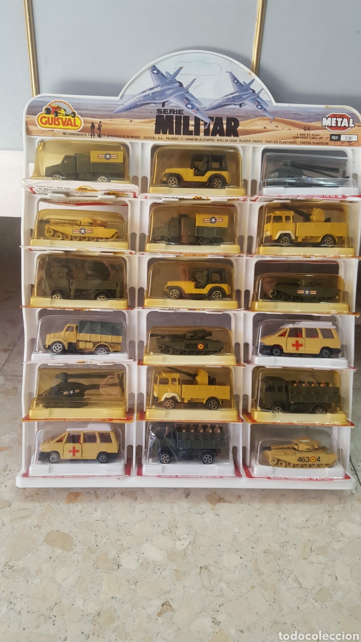 Coches a escala: GUISVAL EXCLUSIVO EXPOSITOR BLISTER 18 CAMI&Oacute;N COCHES VEHICULOS SERIE MILITAR METAL PL&Aacute;STICO NUEVO