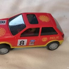 Coches a escala: COCHE HORNBY HOBBIES COMPATIBLE SCALEXTRIC FORD FIESTA ROJO SHELL MADE IN GREAT BRITAIN. Lote 365922761