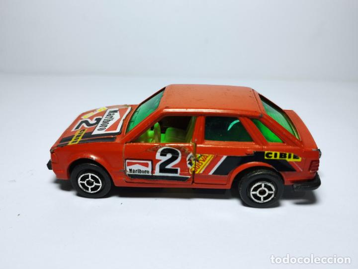 Coches a escala: FORD ESCORT ROJO RALLYE DE GUISVAL CAMPEON 1,64 ULTIMA SERIE