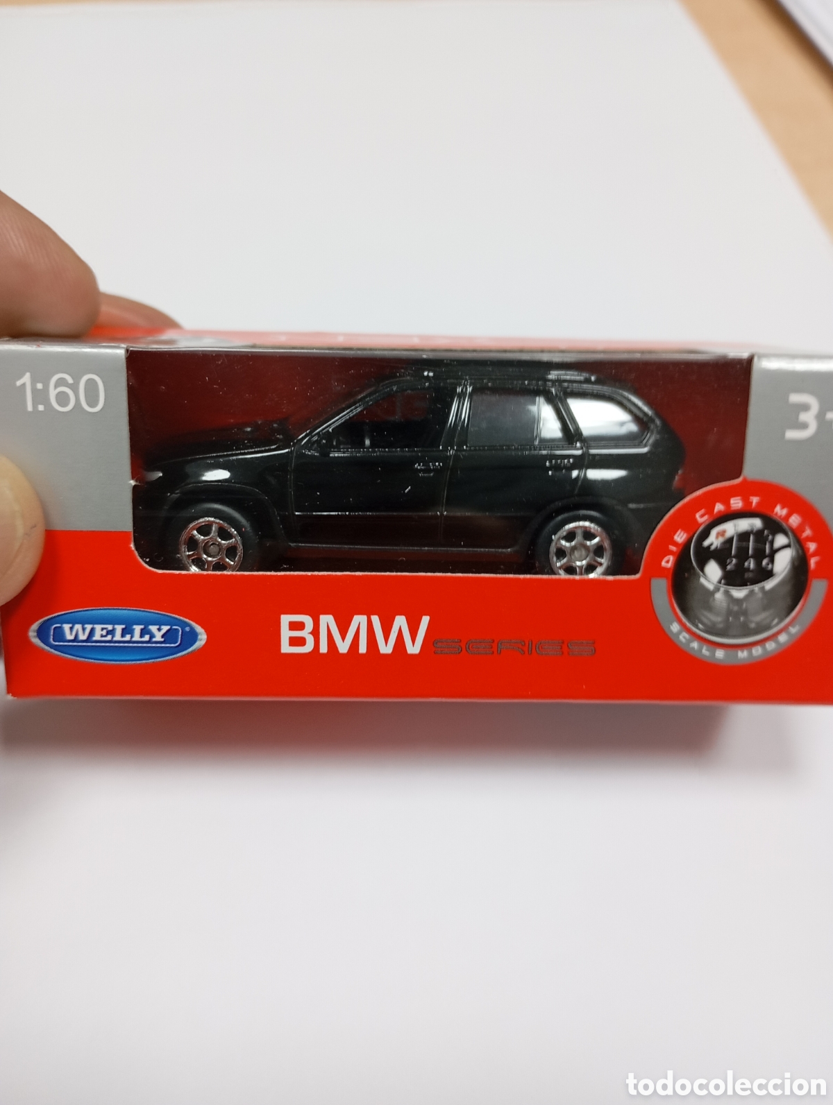 Coches a escala: BMW X5, color negro, escala 1:60, en su caja original