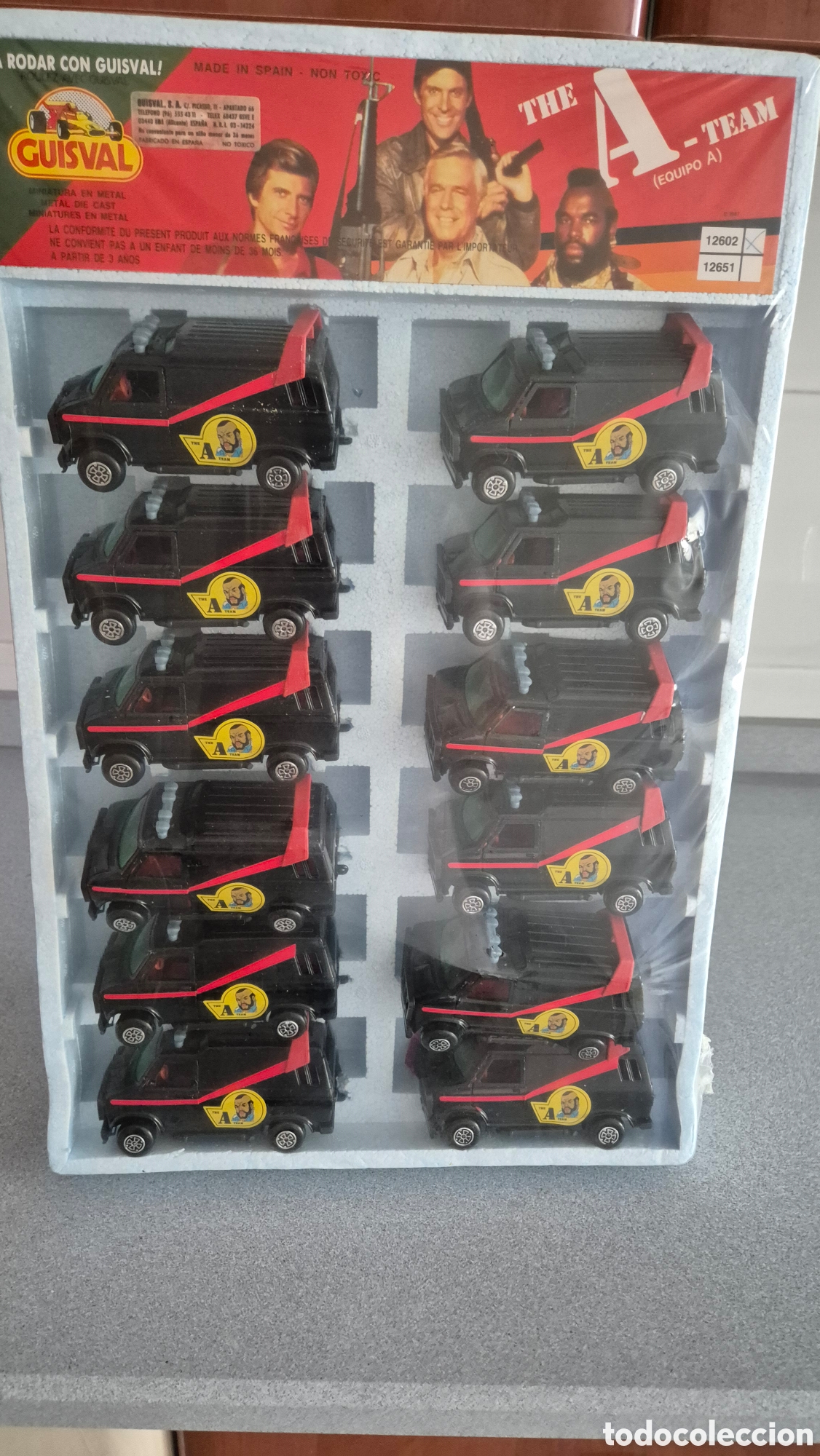 Coches a escala: 12 furgonetas del equipo A Guisval en su caja sin abrir para venta. A&ntilde;os 80