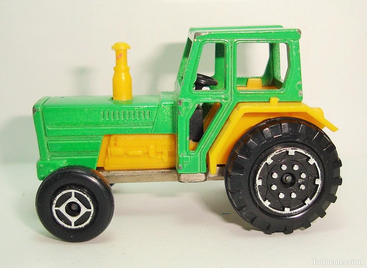 Coches a escala: TRACTOR FORD MAJORETTE ESCALA 1:65 LOTE 32