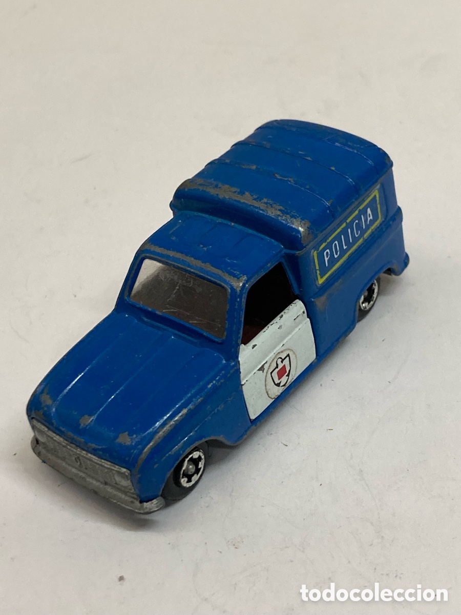 Coches a escala: coche de juguete miniatura, concretamente un Renault 4L furgoneta de polic&iacute;a
