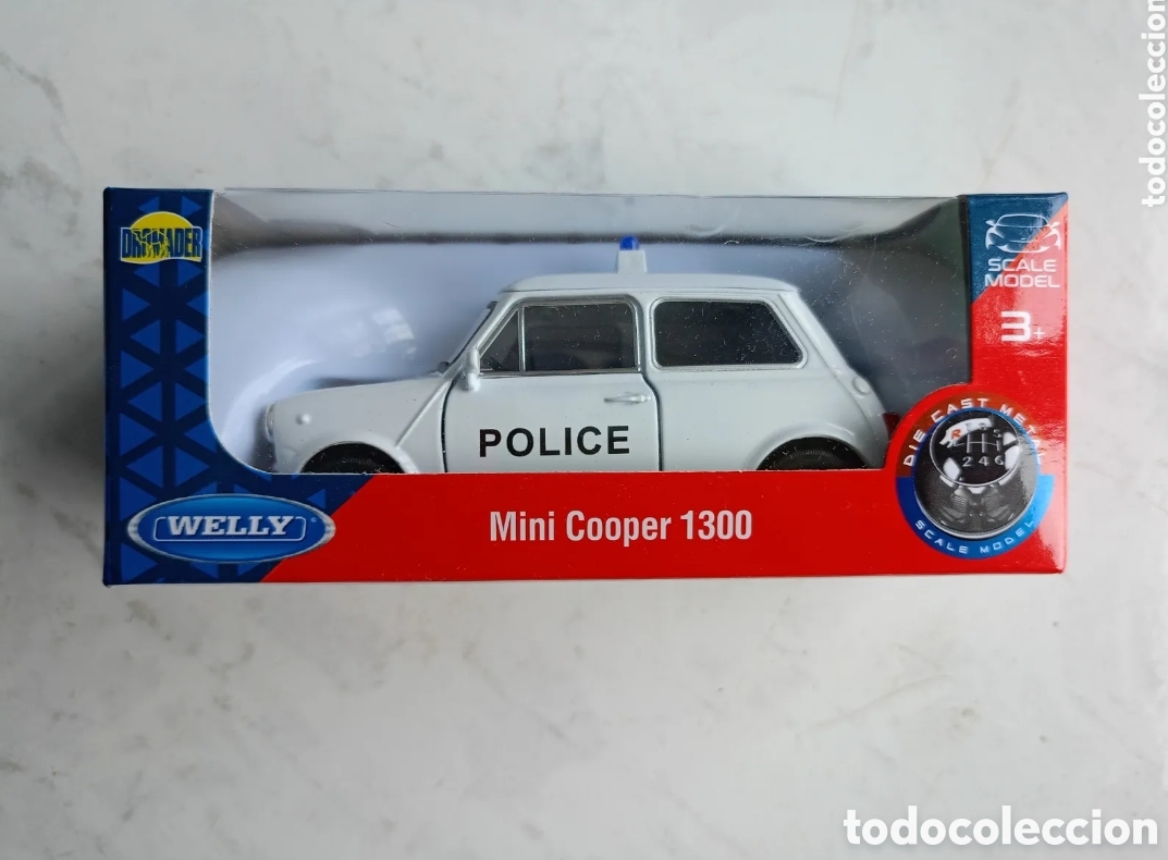 Auto in scala: Mini Cooper 1300 Welly blanco police diecast metal