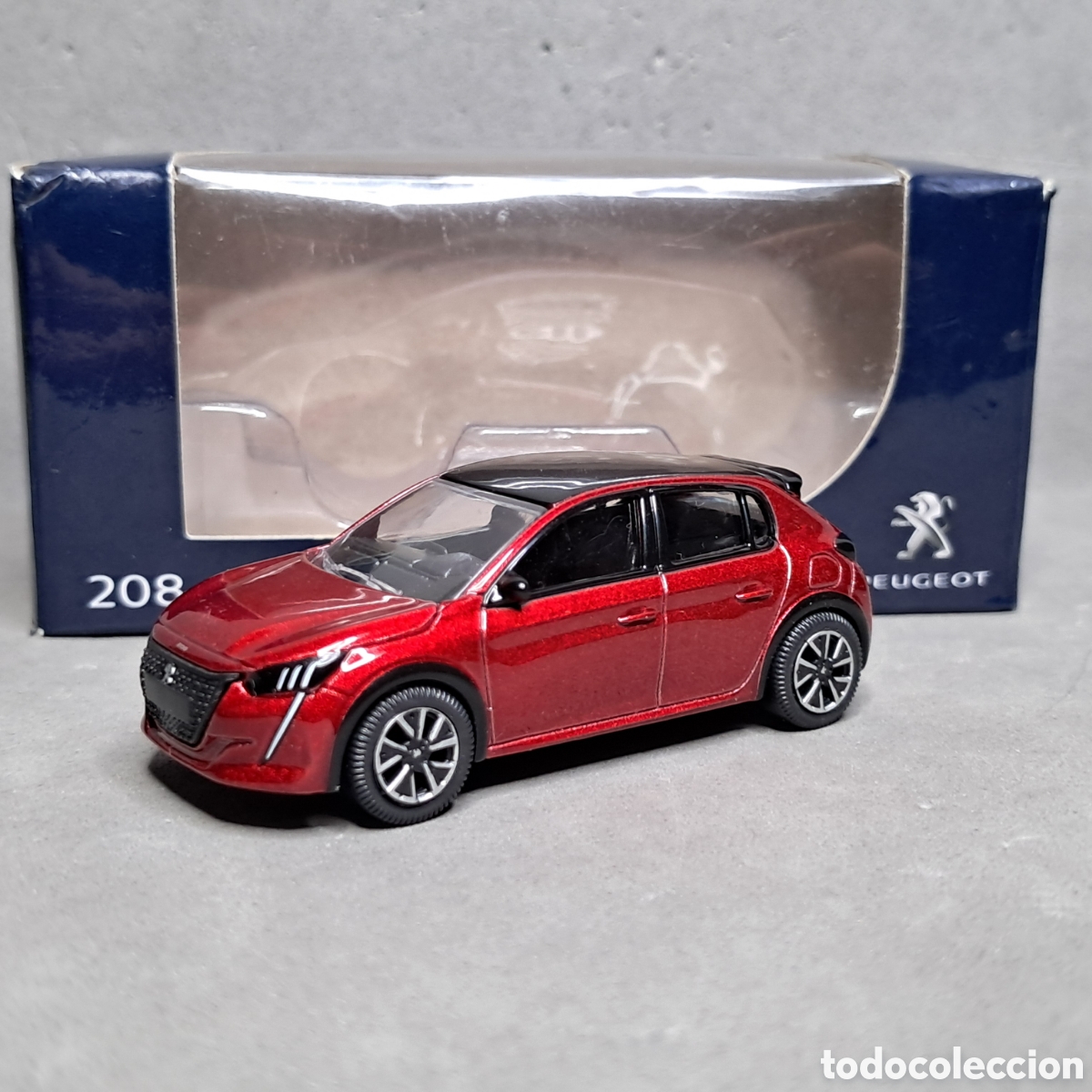 Auto in scala: Peugeot 208 a&ntilde;o 2019 granate de NOREV. Miniatura escala 1/64