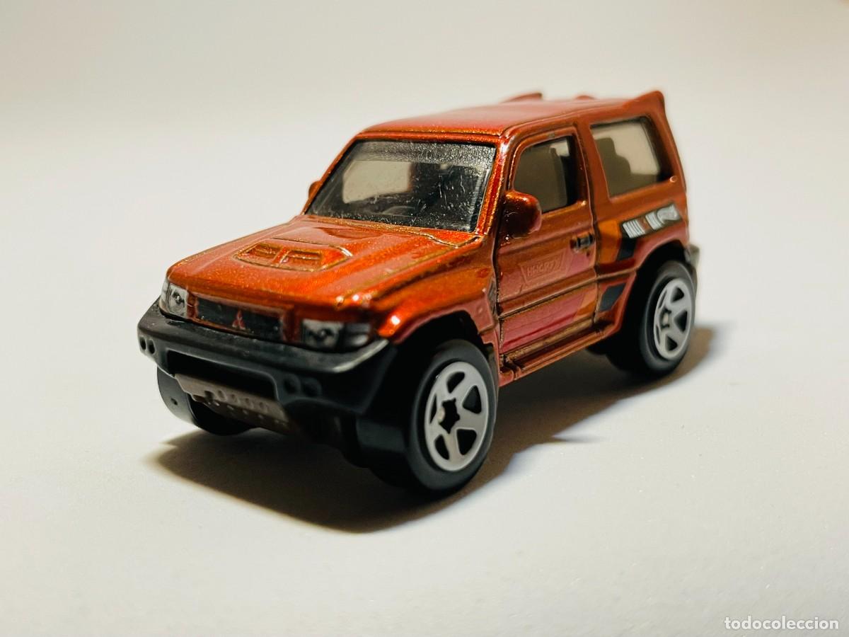 Coches a escala: 2024 MITSUBUSHI PAJERO ORANGE HOTWHEELS #169 SCALE 1;64
