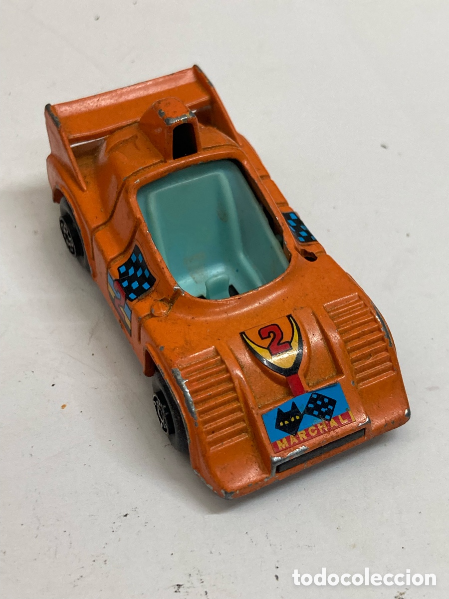 Coches a escala: coche de juguete naranja es un modelo Porsche 936 de la marca Guisval