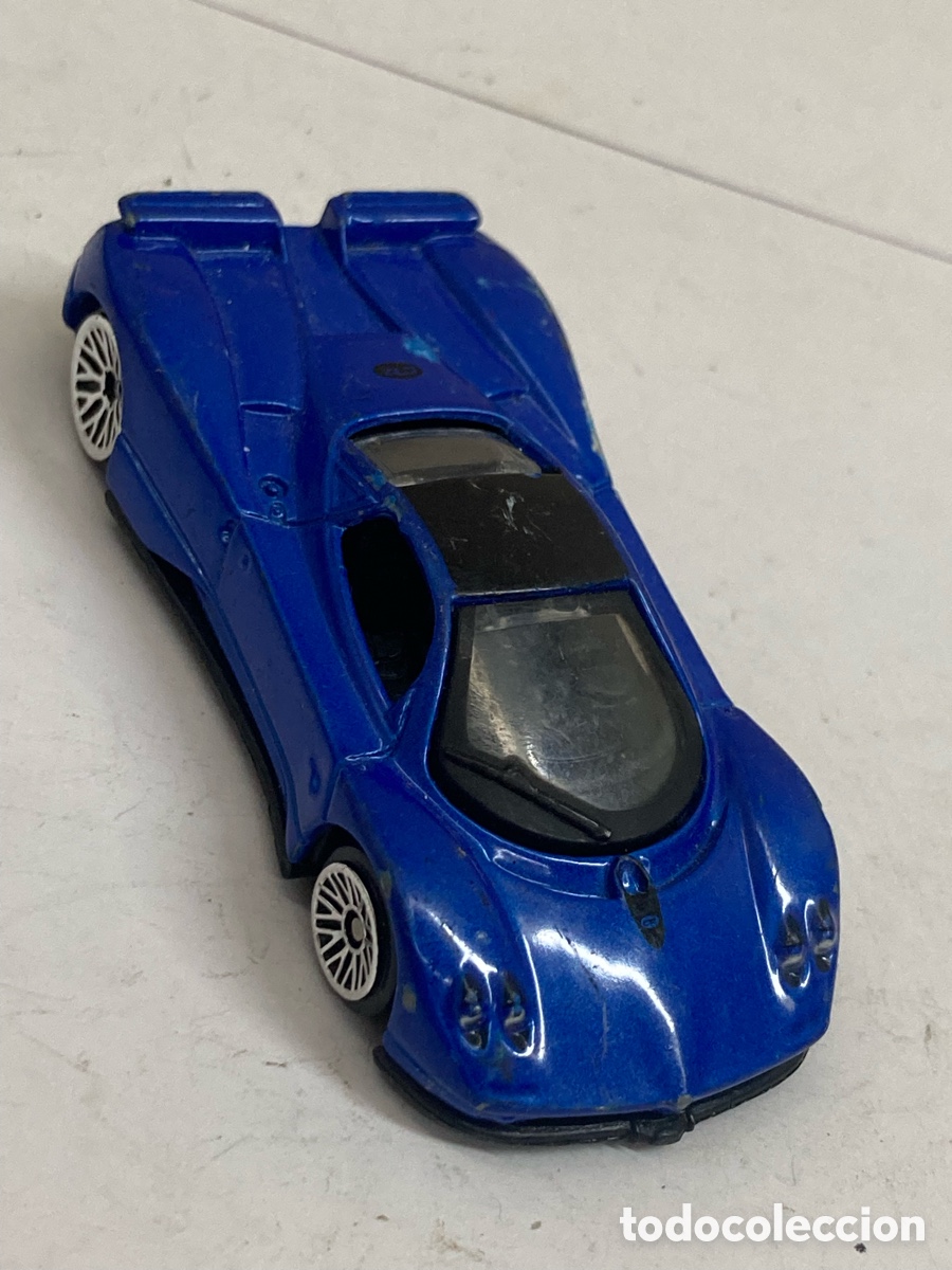 Coches a escala: Se trata de un modelo a escala 1/64 de un Toyota Supra Mk IV de 2002.