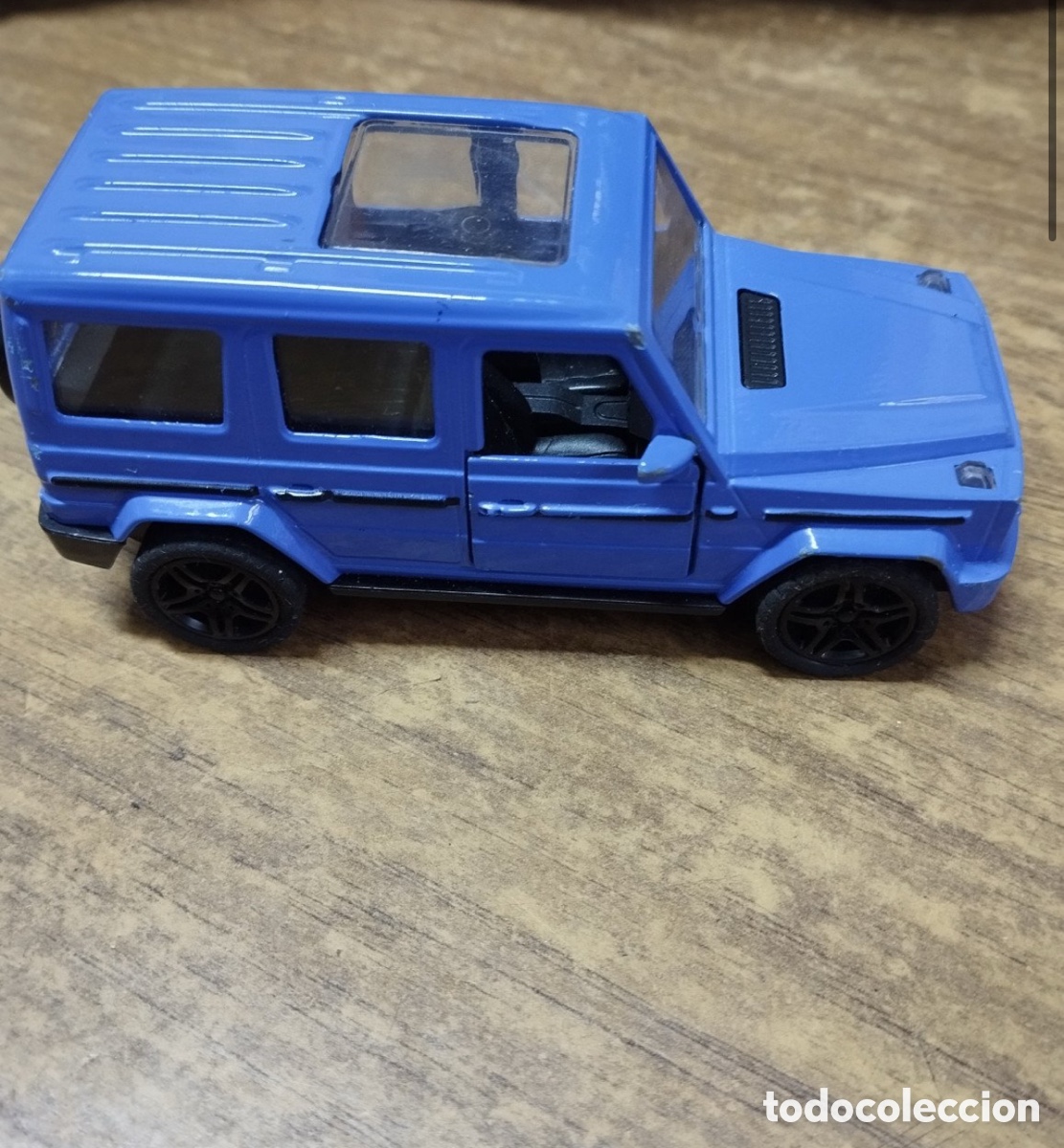 Coches a escala: Coche de metal Mercedes-Benz Clase G / Brabus azul con puertas practicables - Fricci&oacute;n (11 cm)