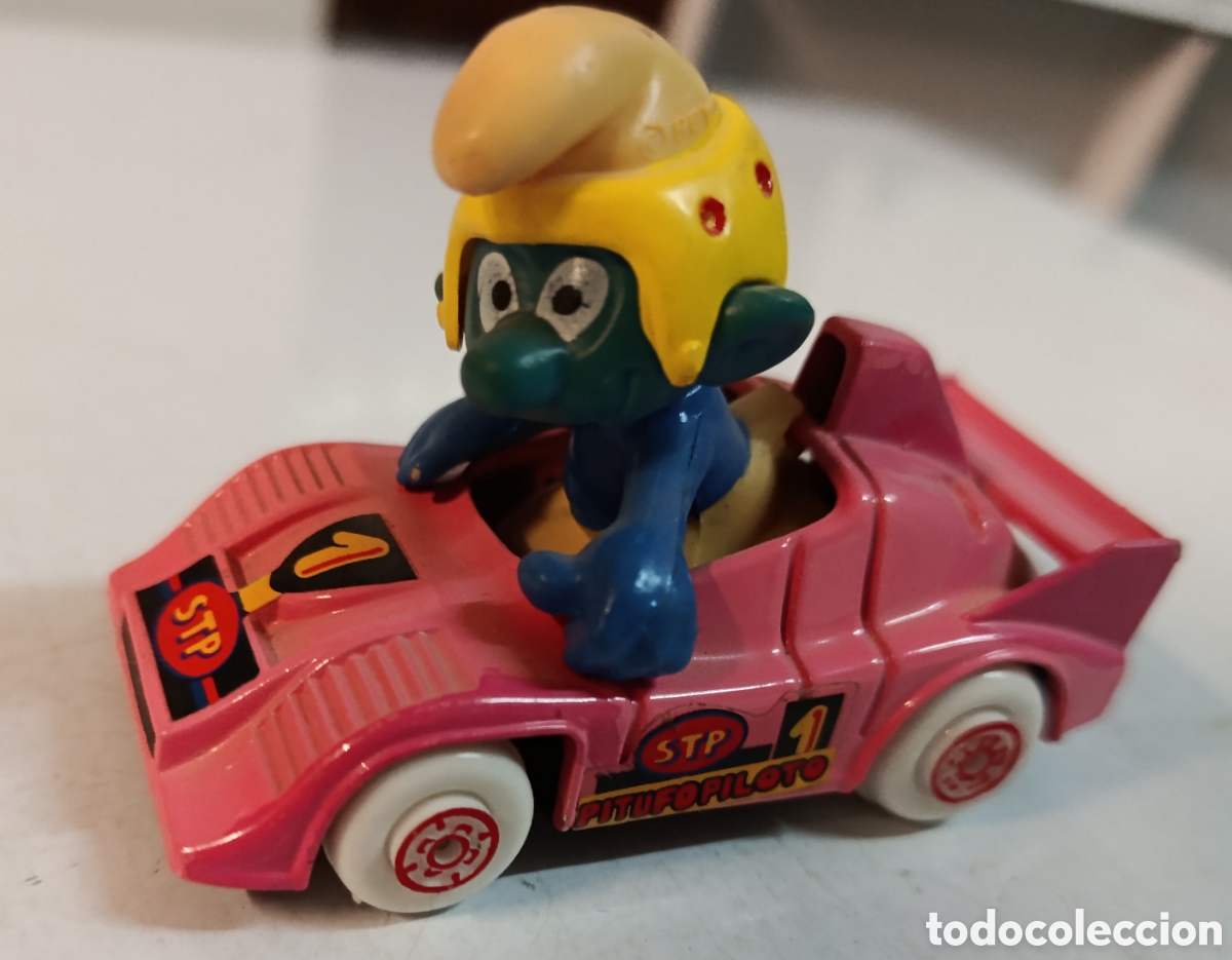 Coches a escala: Pitufo piloto en coche de carreras rosa STP de Guisval , sin usar