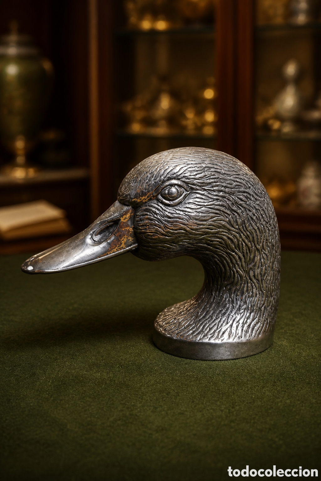 Abrebotellas y sacacorchos de colecci&oacute;n: ABRIDOR DE TAPA; metal plateado en forma de pato, segunda mitad del siglo XX.