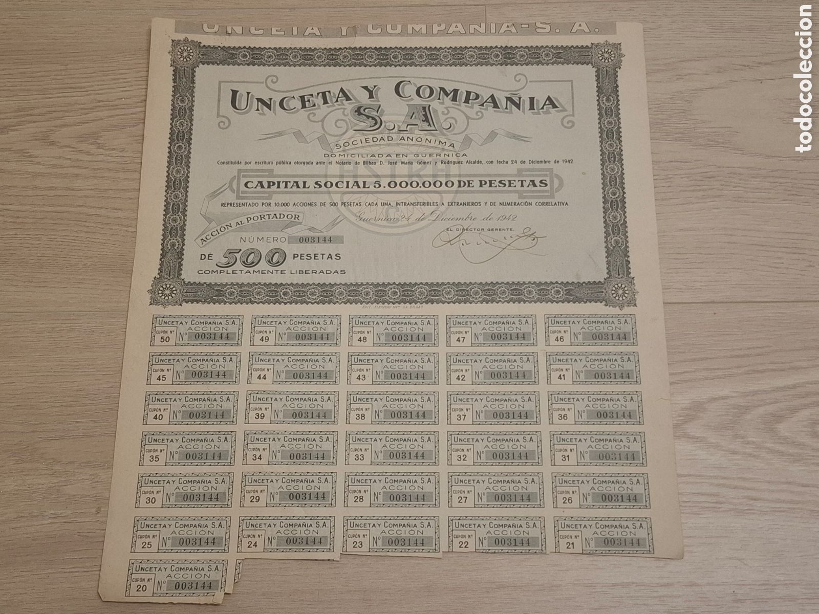 Coleccionismo Acciones Espa&ntilde;olas: Unceta y Compa&ntilde;&iacute;a, S.A. Acci&oacute;n de 500 pesetas, Guernica 1942, firma original, pistolas Astra