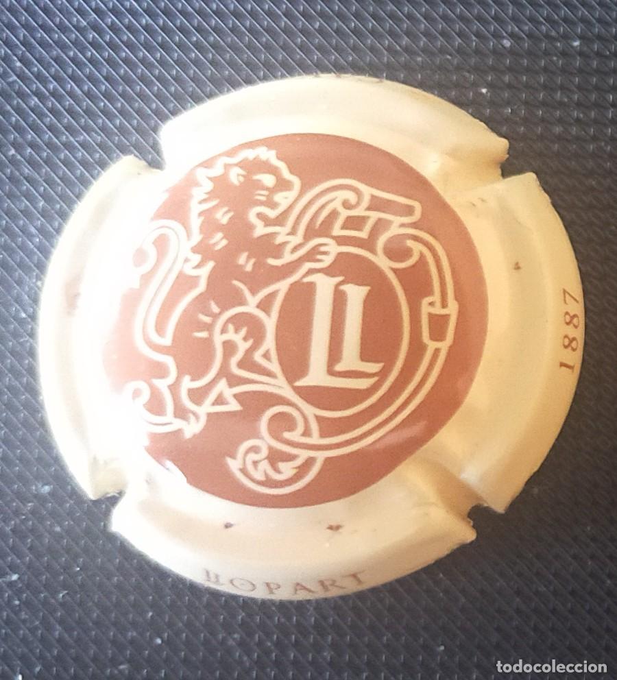 Collectionnisme de cava: PLACA DE CAVA LLOPART CON LOGO DE LEON SOBRE FONDO COLOR TEJA