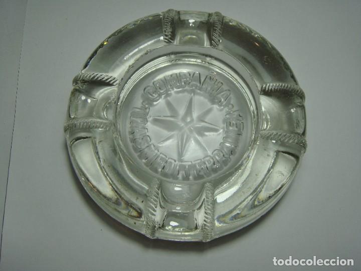 Aschenbecher: Antiguo cenicero de cristal macizo. Con publicidad de la Compa&ntilde;&iacute;a Transmediterr&aacute;nea.