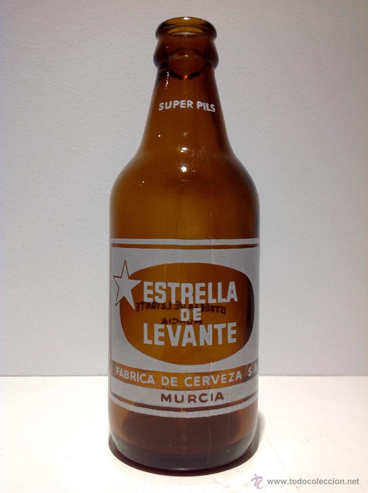 Coleccionismo de cervezas: ANTIGUA BOTELLA DE CERVEZA * ESTRELLA LEVANTE * SUPER PILS EN CUELLO, TERCIO, 33 CL ESPINARDO - MURC