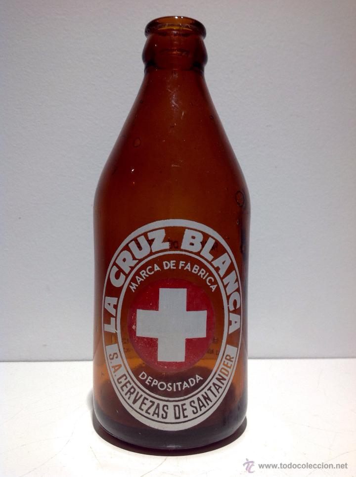 Collectionnisme de bi&egrave;res: ANTIGUA botella de cerveza la cruz blanca, 1/3, S.A a la derecha