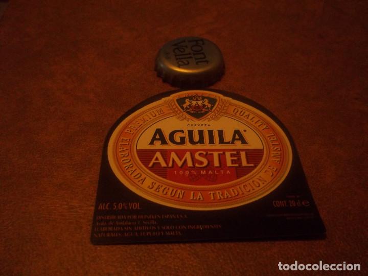 Coleccionismo de cervezas: ANTIGUA ETIQUETA CERVEZA AGUILA AMSTEL 100% MALTA 20 CL HEINEKEN ESPA&Ntilde;ANUEVA SIN USAR