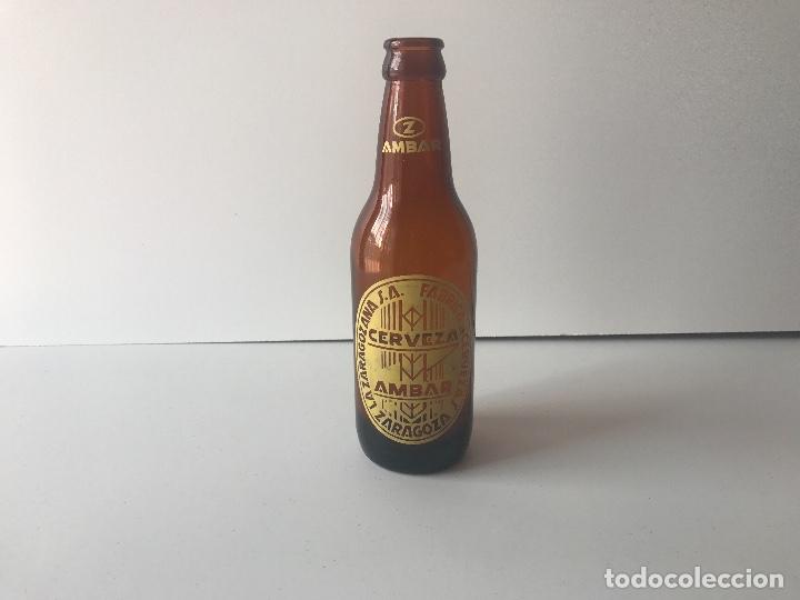 Coleccionismo de cervezas: Botella cerveza Ambar la zaragozana, Modelo 33cl con hombros muy raro y dificil de conseguir.