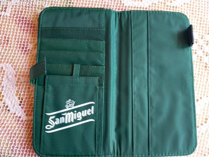 Coleccionismo de cervezas: **CARTERA CON MUCHOS DEPARTAMENTOS PUBLICIDAD DE SAN MIGUEL (22/12/1 CM)**