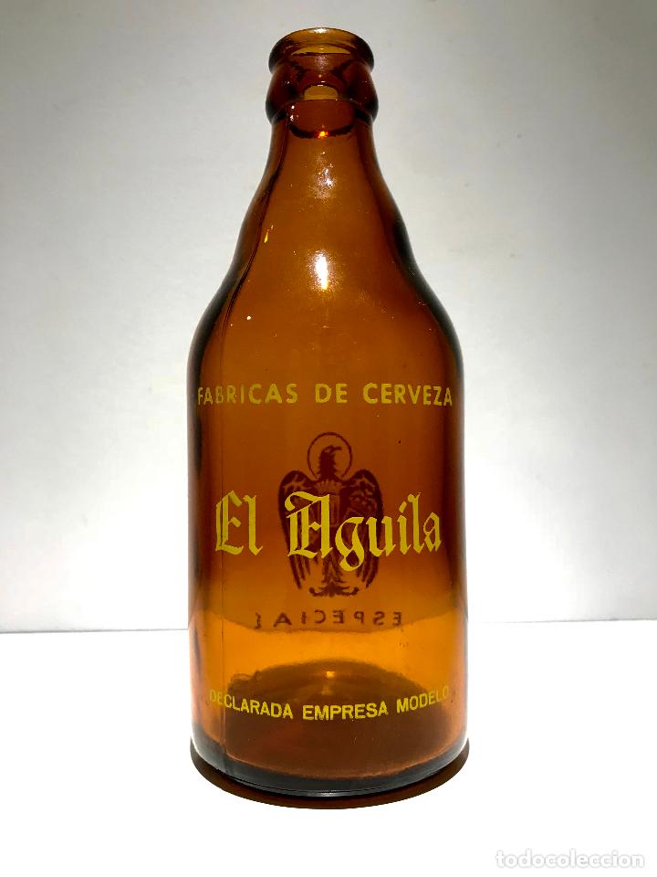 Coleccionismo de cervezas: ANTIGUA BOTELLA DE CERVEZA EL AGULA, TERCIO 1/3,DECLARADA EMPRESA MODELO