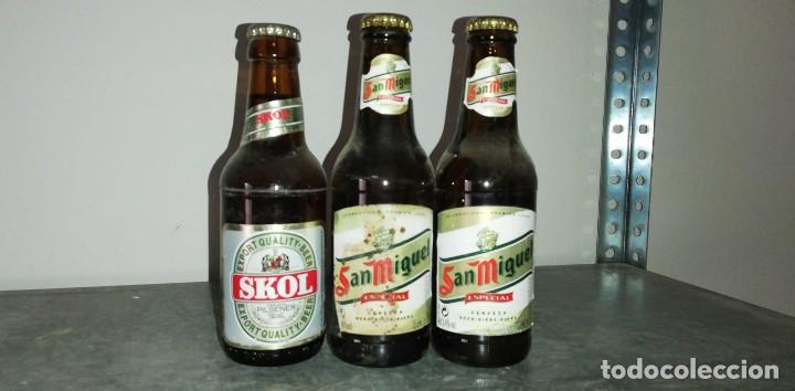 Coleccionismo de cervezas: BOTELLAS CERVEZA SKOL Y SAN MIGUEL LOTE DE 3 CON ETIQUETA Y CHAPA DE UN QUINTO
