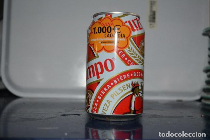Coleccionismo de cervezas: LATA DE CERVEZA MARCA CRUZCAMPO GANA 1000 EUROS CADA DIA 330 ML