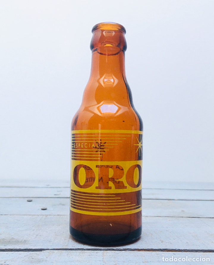 Coleccionismo de cervezas: ANTIGUA BOTELLA DE CRISTAL DE CERVEZA ORO BOTELL&Iacute;N 185CC VINTAGE DE VIDRIO BEER