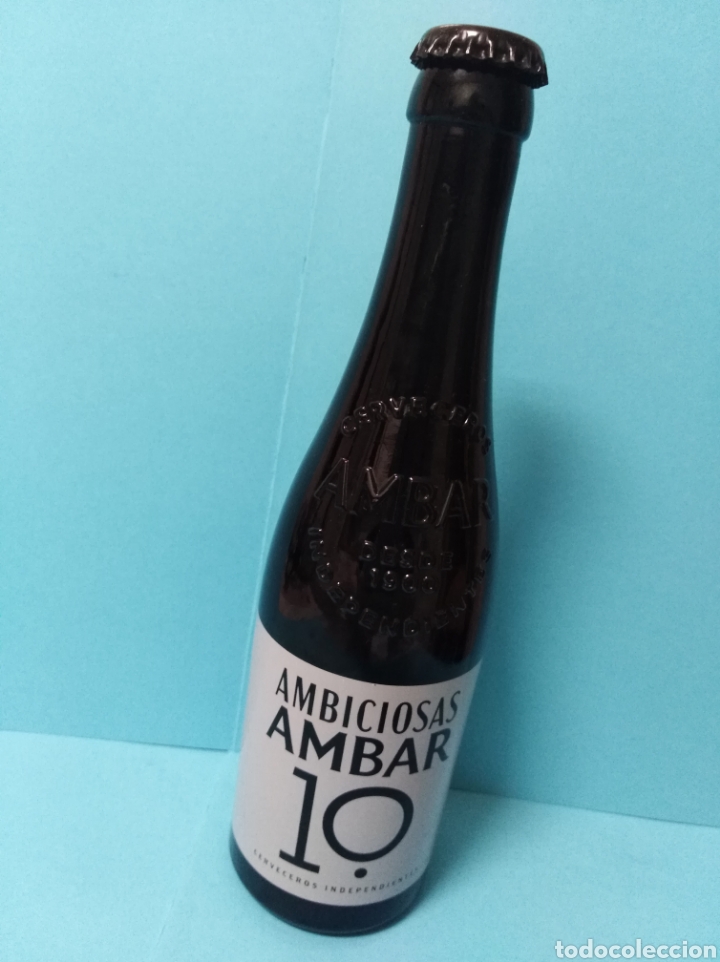 Coleccionismo de cervezas: Botella cerveza Ambar 10 Ambiciosas vac&iacute;a con chapa